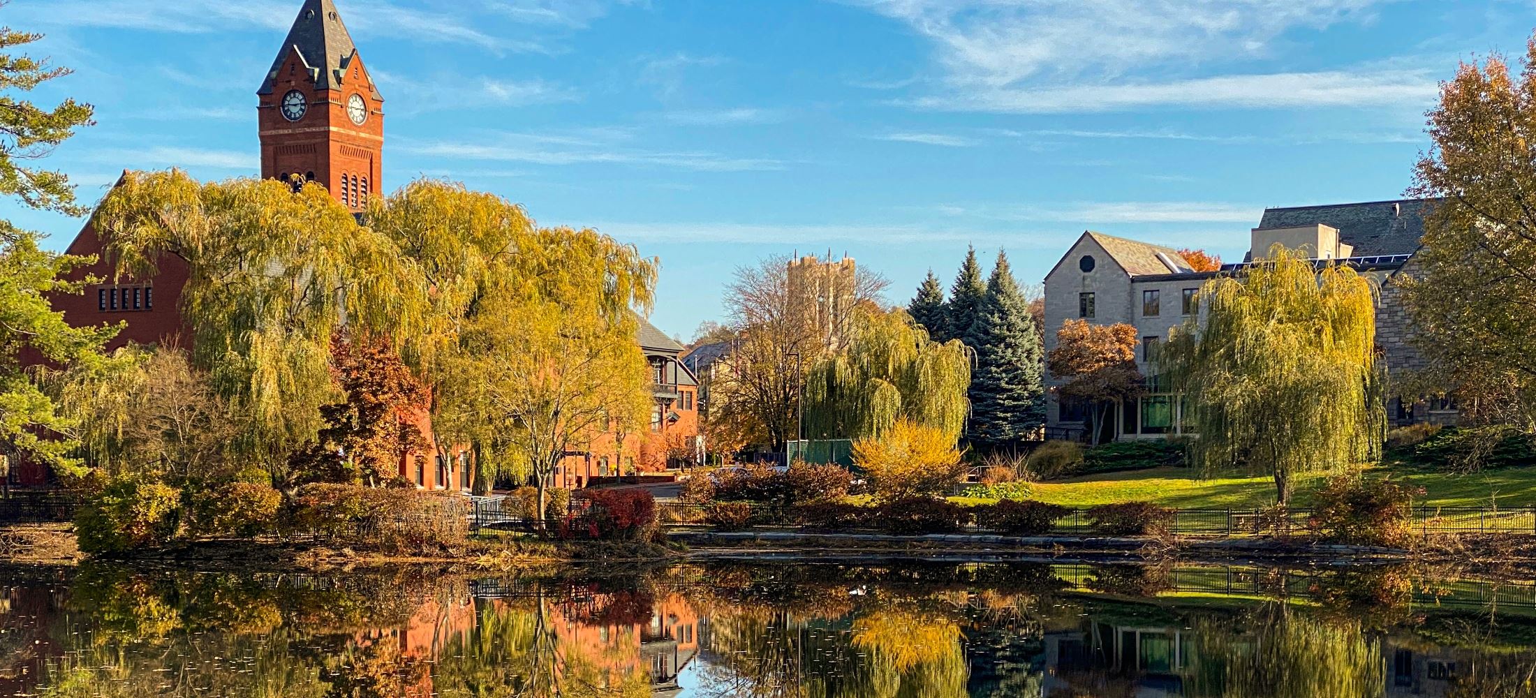 Winchester in autumn — campus greens and water near downtown